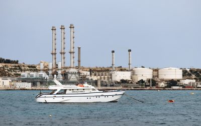 yacht-on-water-near-industrial-refinery-coastal-facility.jpg - RadarPress
