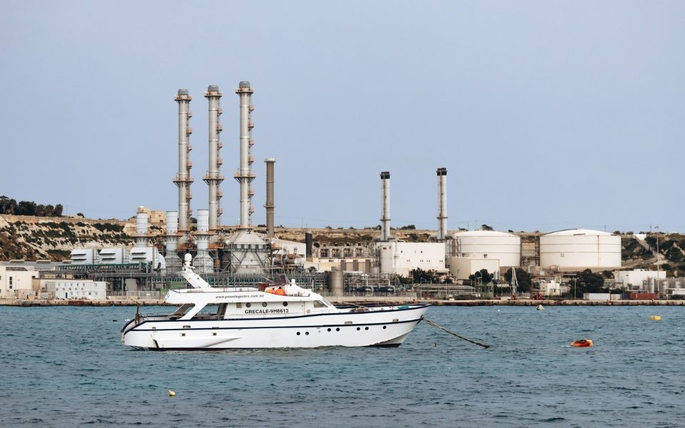 yacht-on-water-near-industrial-refinery-coastal-facility.jpg - RadarPress