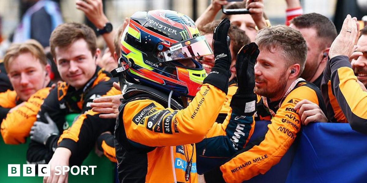 Oscar Piastri gives high fives to his McLaren team members after coming second at Suzuka