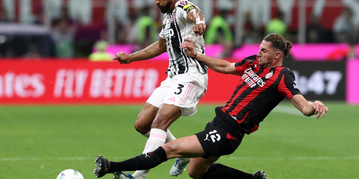 MILAN, ITALY - APRIL 26: Bremer of Juventus is challenged by Adrien Rabiot of AC Milan during the Serie A match between AC Milan and Juventus FC at Giuseppe Meazza Stadium on April 26, 2026 in Milan, Italy. (Photo by Marco Luzzani/Getty Images)